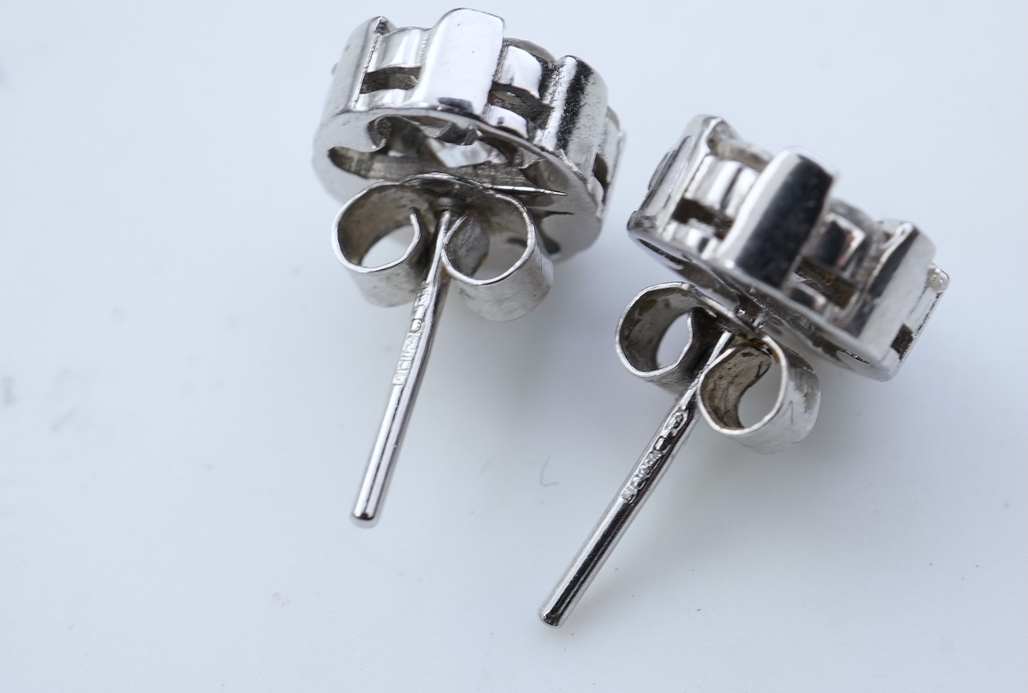 A pair of diamond stud earrings